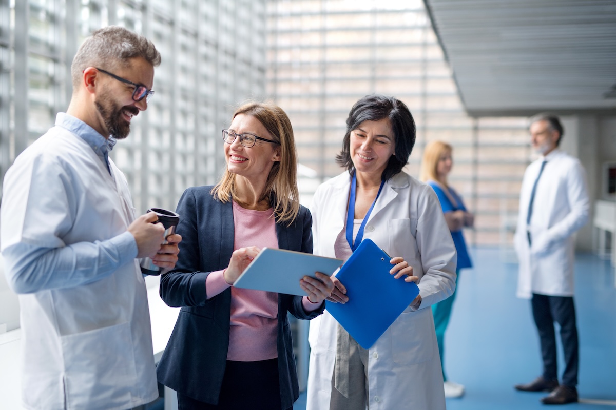 Healthcare leadership team collaborating in a medical office